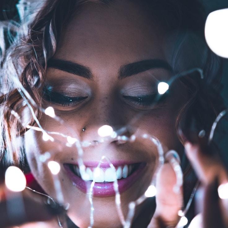 Avery Patel, Lead Design Curator at Novel Route Frame, reviewing corporate floral arrangements